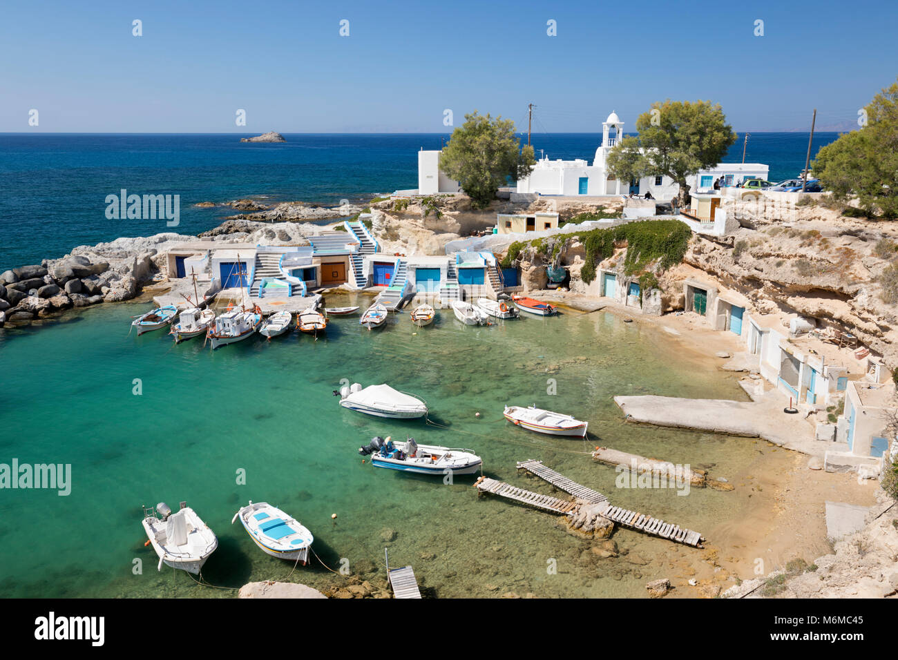 View over fishing harbour with boats and colourful boat houses, Mandrakia, Milos, Cyclades, Aegean Sea, Greek Islands; Greece; Europe Stock Photo