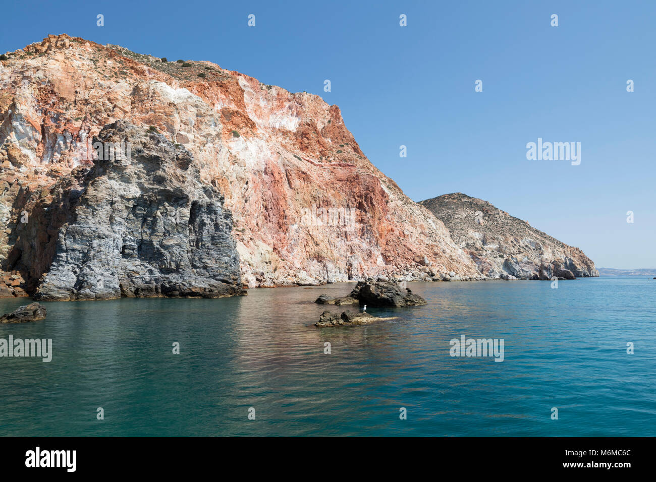 Colourful rocks in cliffs on south east coast near Thiorichio, Milos, Cyclades, Aegean Sea, Greek Islands; Greece; Europe Stock Photo