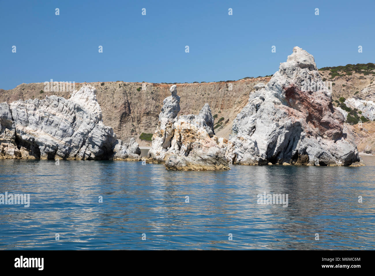 Rock formations on south east coast of island with rock resembling famous statue of Venus de Milo, near Paliochori, Milos, Cyclades, Aegean Sea, Greek Stock Photo