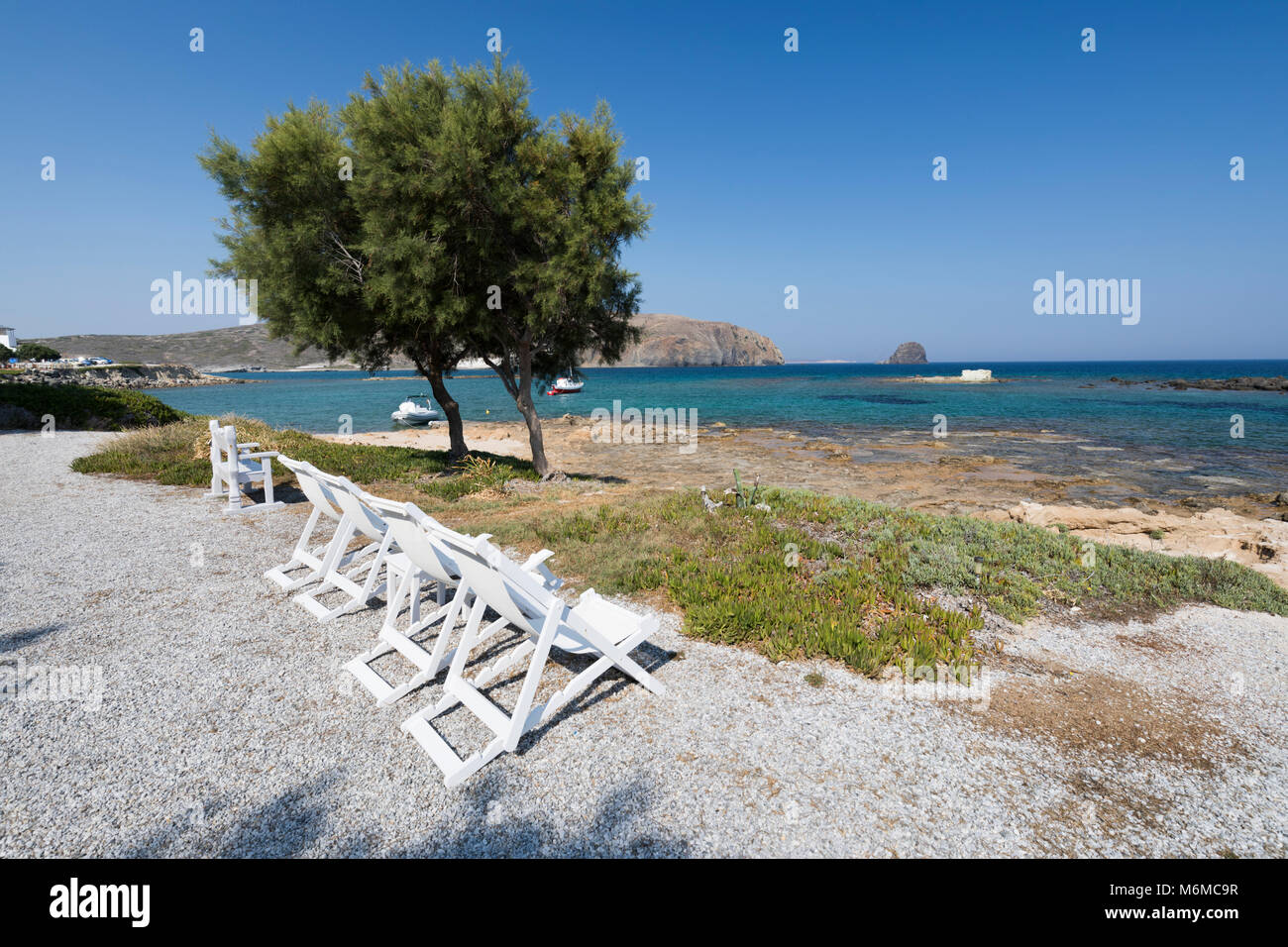 Deckchairs looking over the sea at Nefeli Sunset Studios, Pollonia, Milos, Cyclades, Aegean Sea, Greek Islands; Greece; Europe Stock Photo
