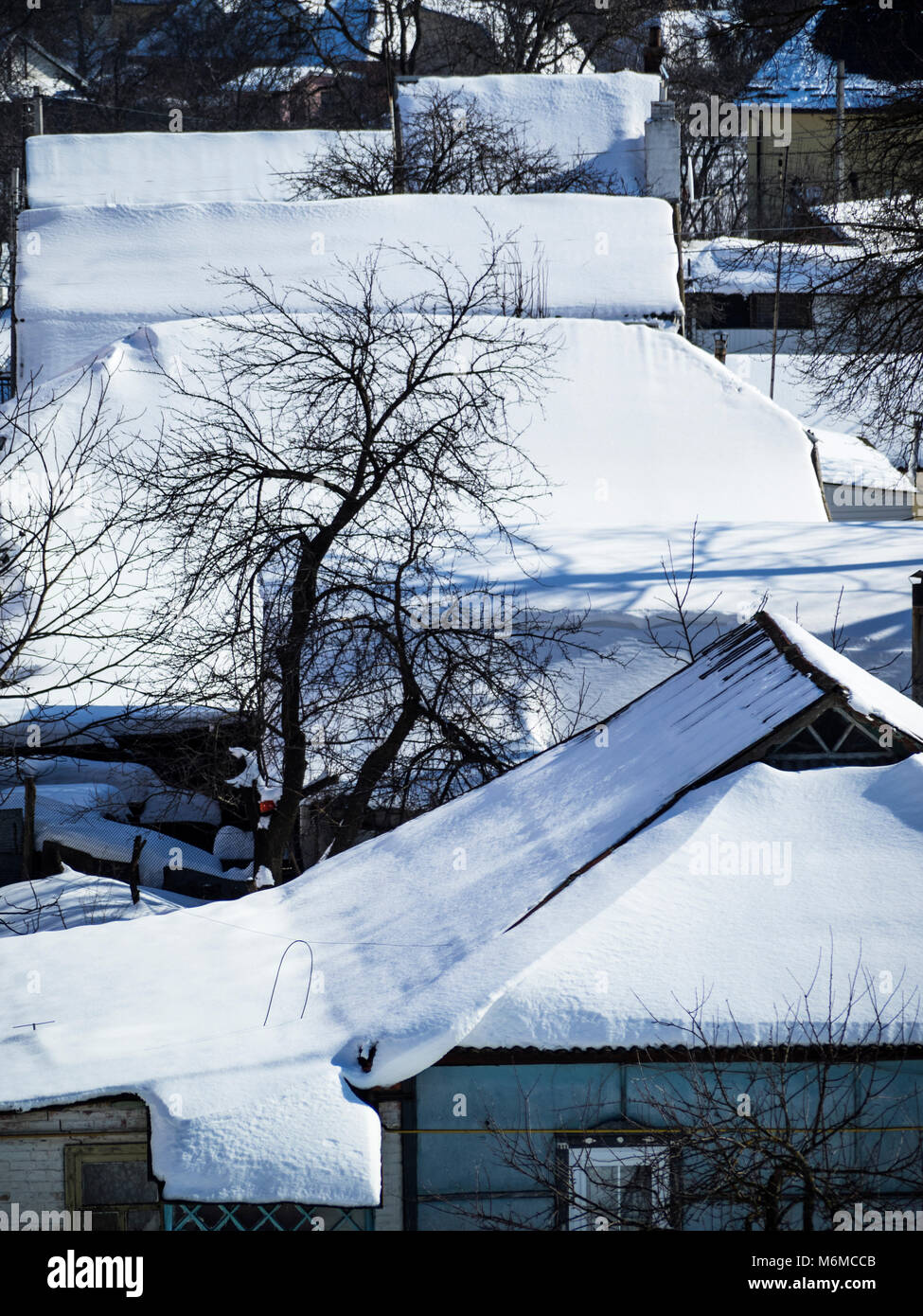 The roofs of private houses covered with snow Stock Photo - Alamy