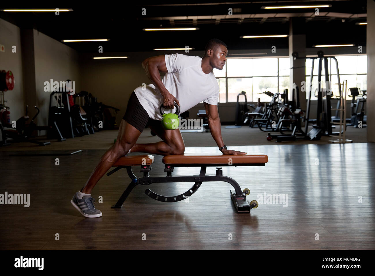 African man lifting a kettlebell Stock Photo