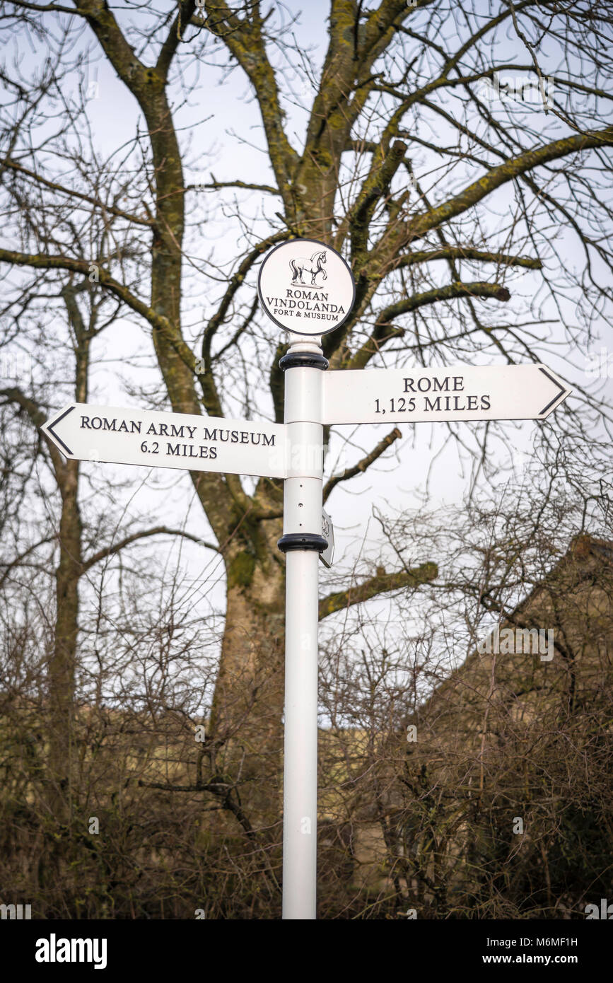 Signpost at the entrance to the Vindolanda Fort and Museum near Hadrian's Wall in Northumberland, England, UK Stock Photo