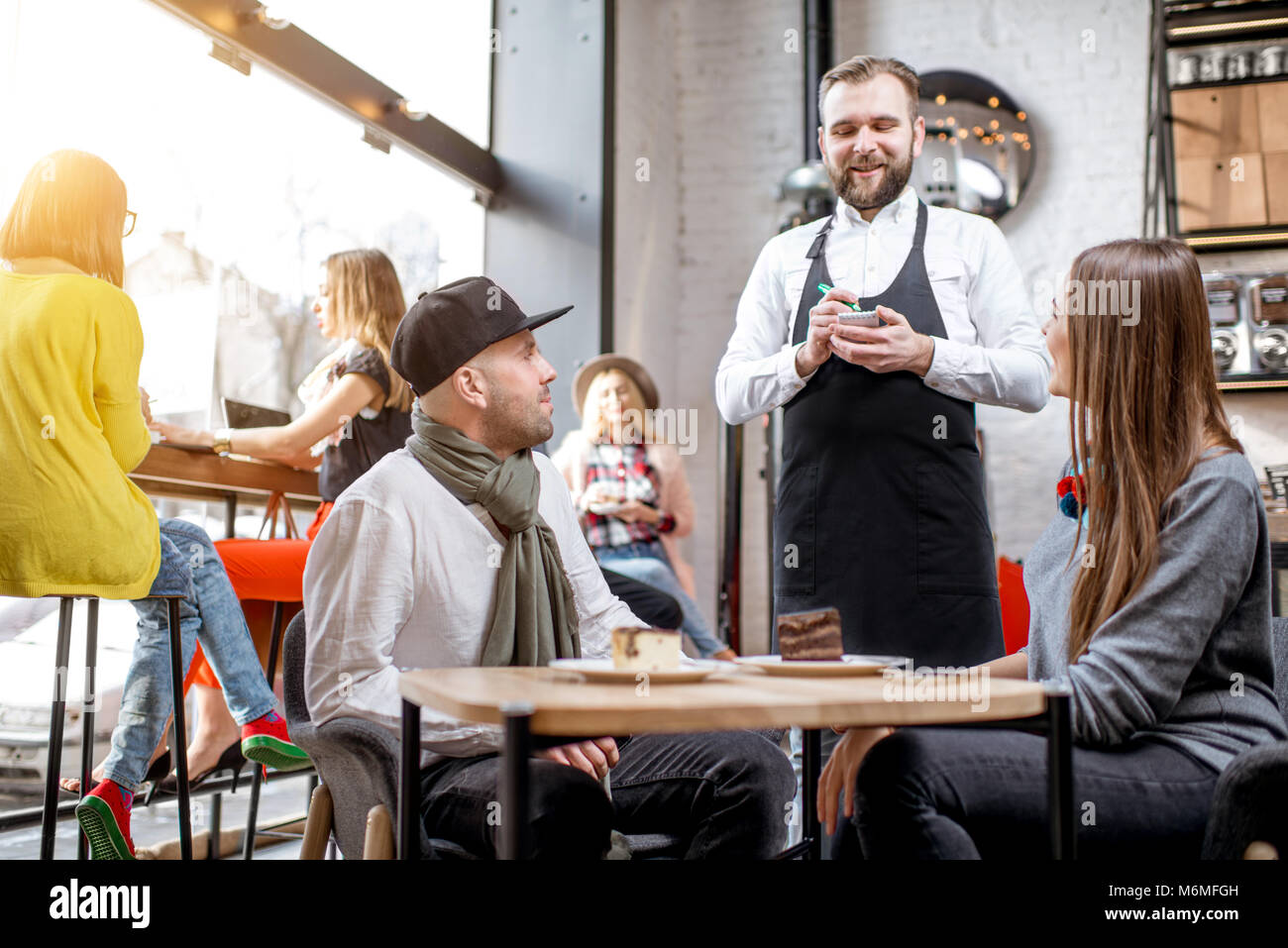 Couple Ordering In The Cafe Stock Photo Alamy
