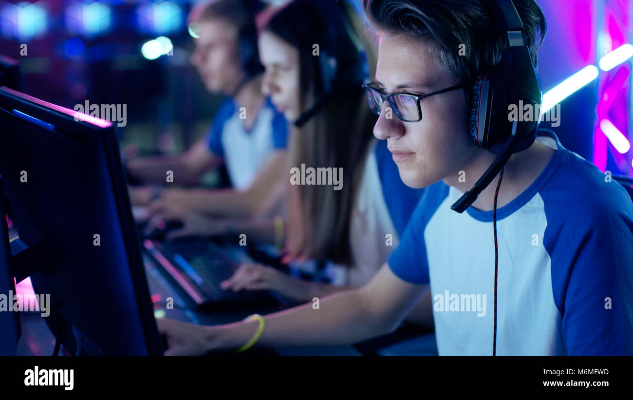 Professional Boy Gamer Plays in Video Game on a eSports Tournament