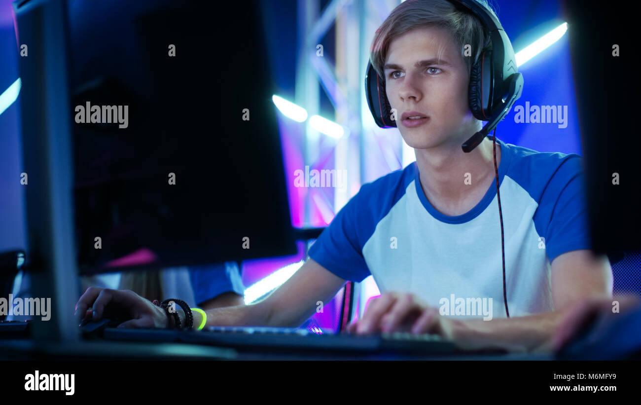Professional Boy Gamer Plays in Video Game on a eSports Tournament/ in