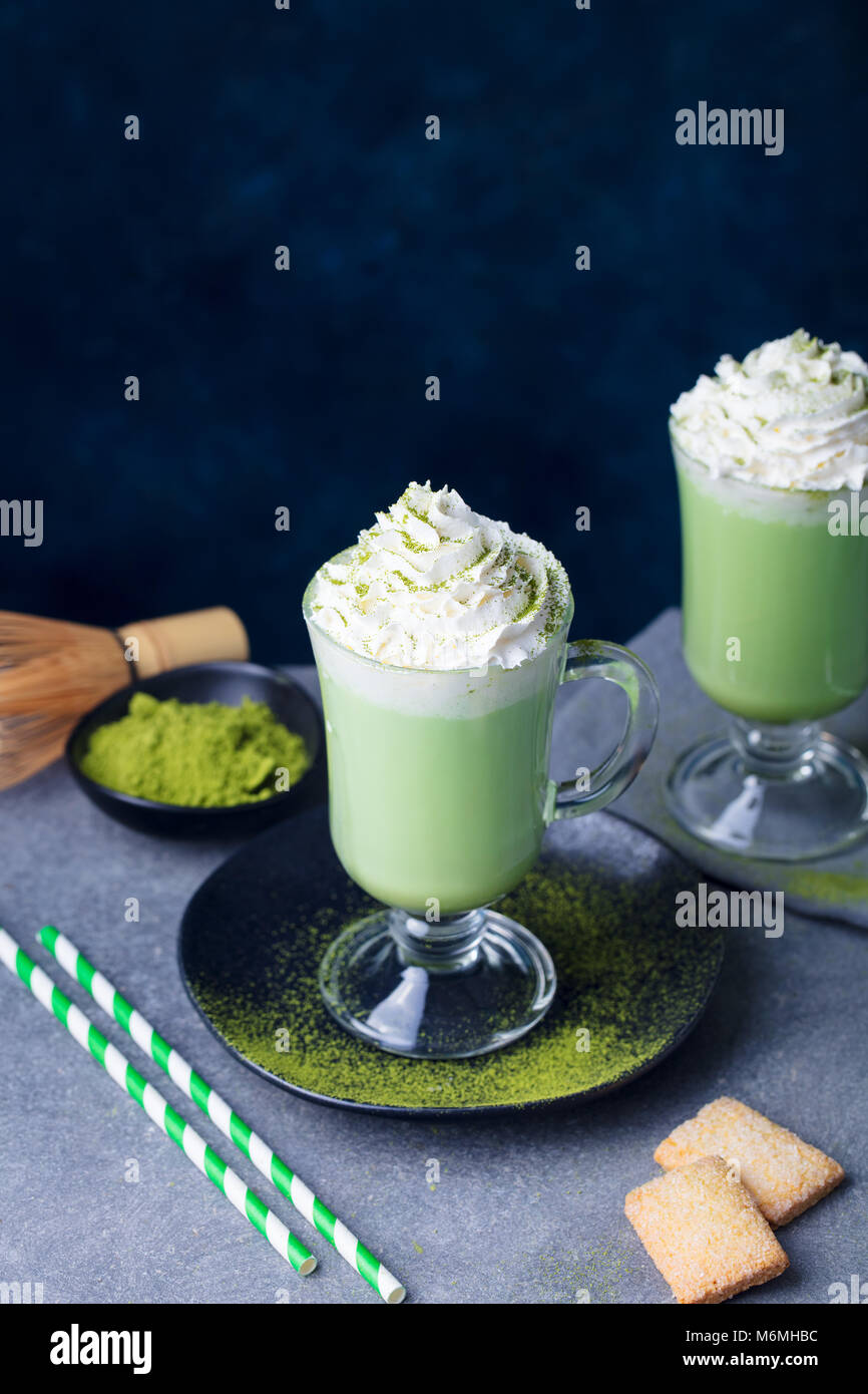 Matcha green tea latte with whipped cream. Copy space Stock Photo Alamy
