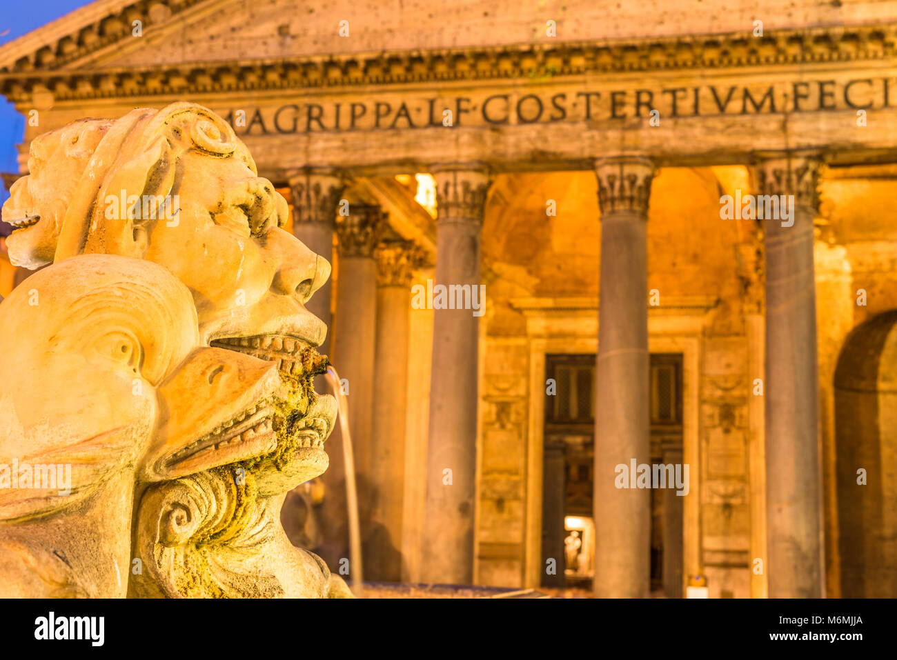 Ancient Roman temple the Pantheon now a church with Fontana del Pantheon at dusk, Rome, Lazio, Italy. Stock Photo