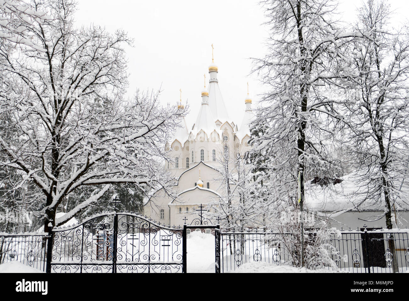 Winter landscape white stone temple. Day, Russia, Moscow, Drozhzhino Polygon. Stock Photo