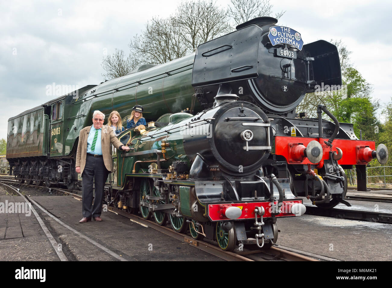 Sir William McAlpine and grand daughters with locomotives Flying Scotsman and Typhoon from RH&DR - Reunited 90 years after the steam engines first met Stock Photo