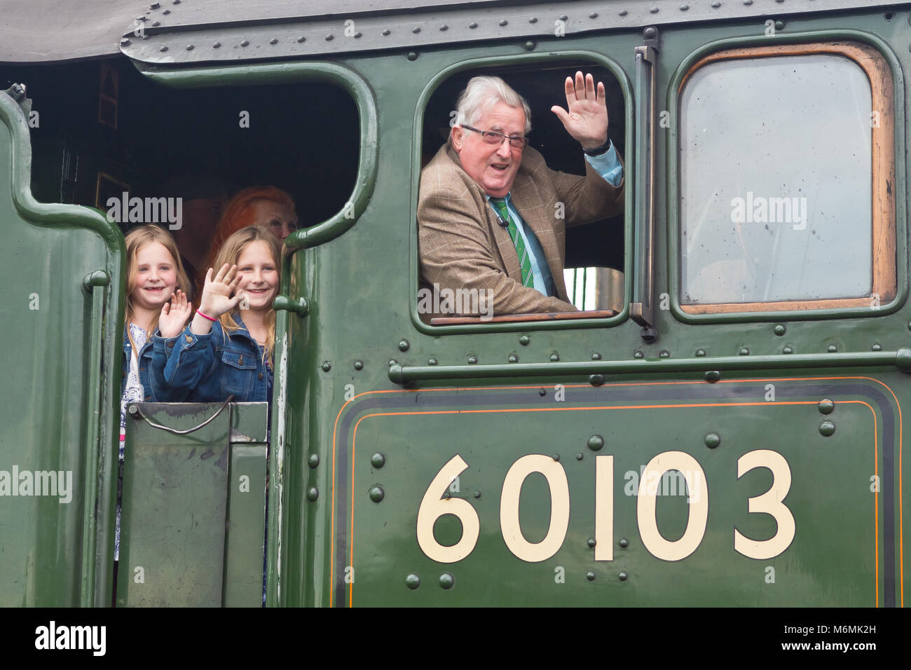 Sir William McAlpine and grand daughters with locomotives Flying Scotsman and Typhoon from RH&DR - Reunited 90 years after the steam engines first met Stock Photo