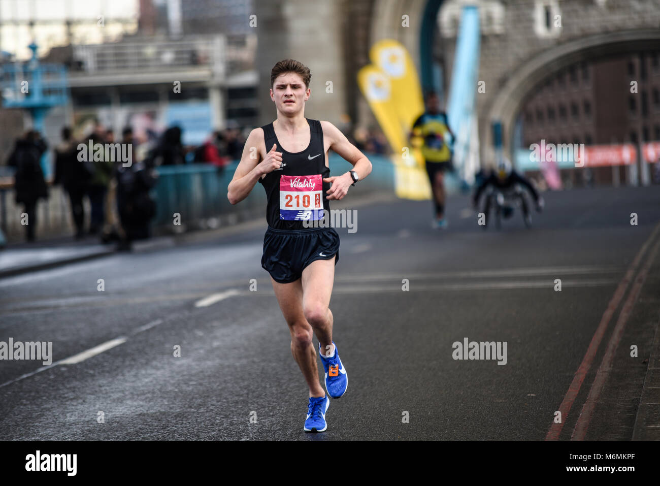 William Richardson 210 running in the Vitality Big Half marathon crossing Tower Bridge, London, UK Stock Photo