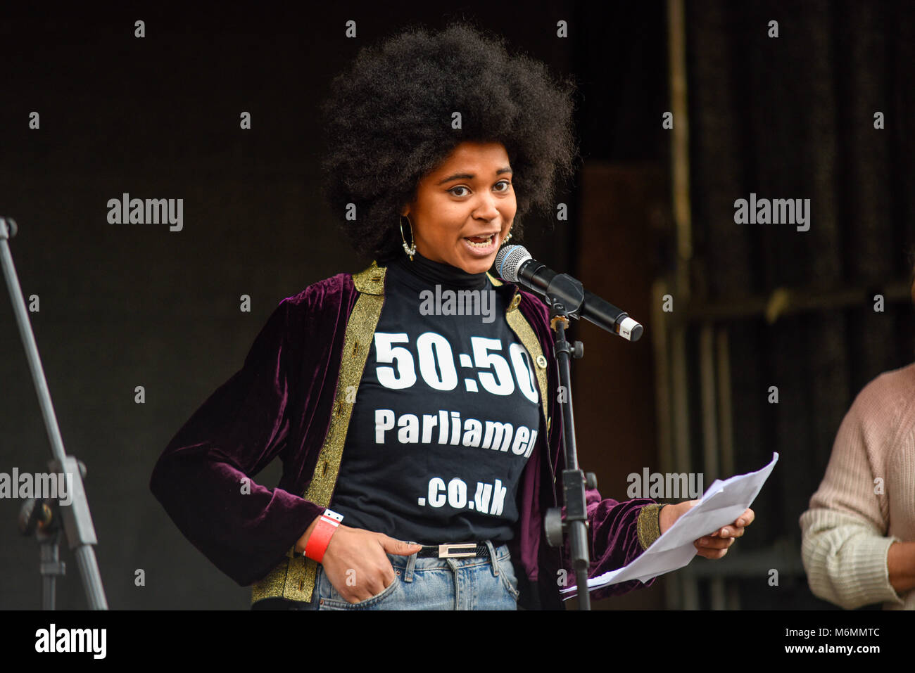 Isabel Adomakoh Young of 50:50 Parliament campaign speaking at the March 4 Women equality protest organised by Care International in London Stock Photo