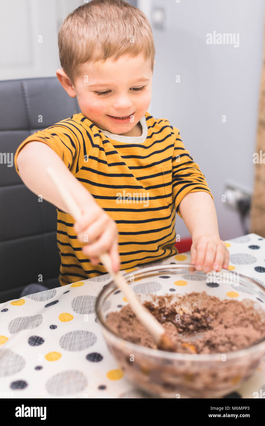 Boy baking chocolate brownies and making a mess Stock Photo Alamy