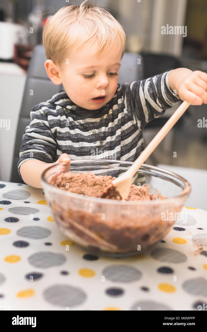 Boy baking chocolate brownies and making a mess Stock Photo Alamy