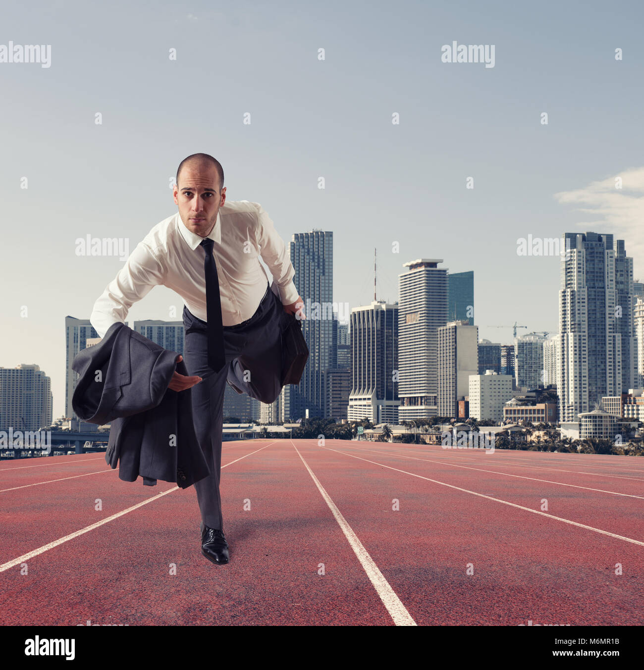 Businessman acts like a runner. Competition and challenge in business concept Stock Photo Alamy