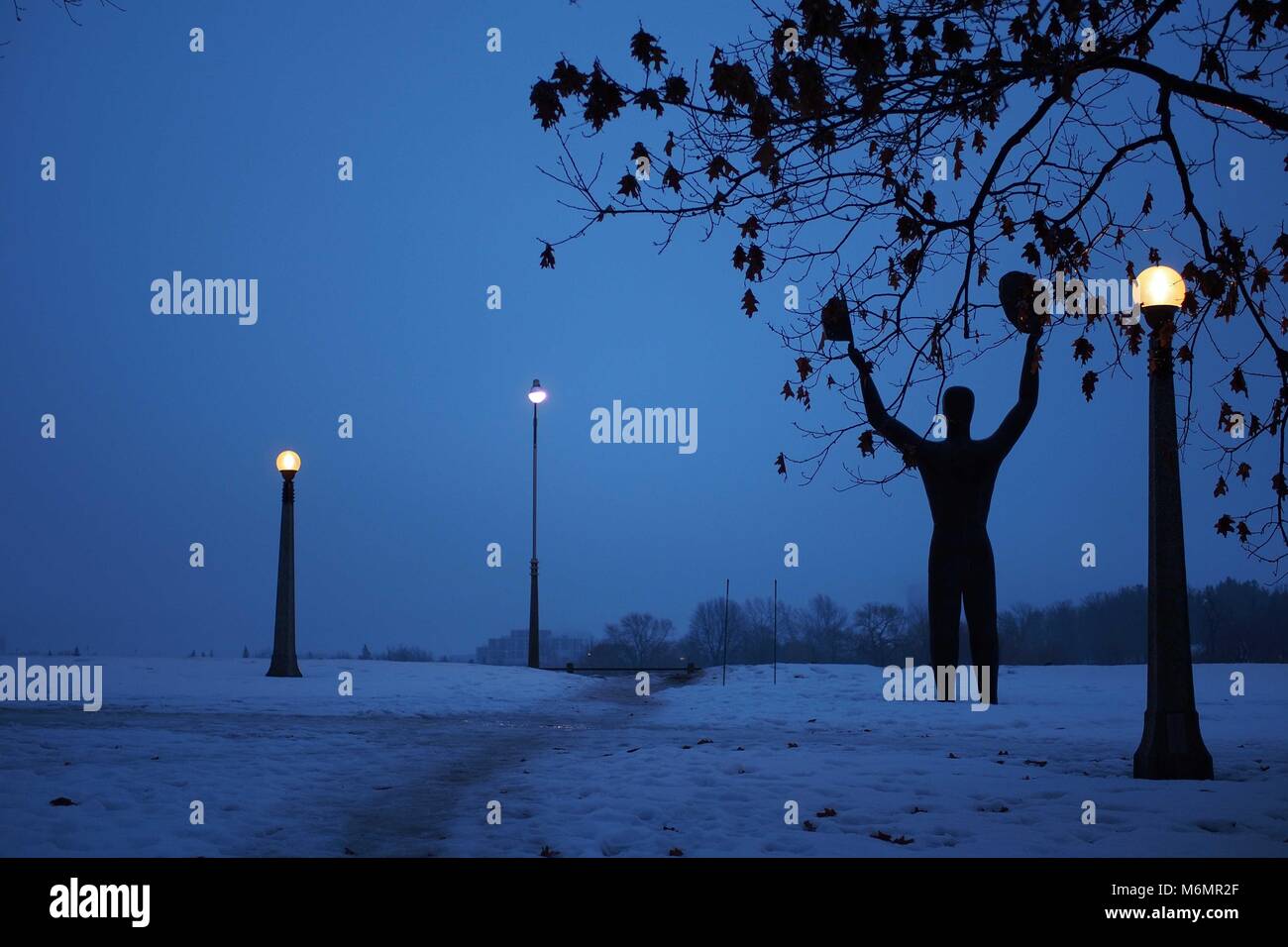 Man with Two Hats sculpture, late winter afternoon, Ottawa, Ontario