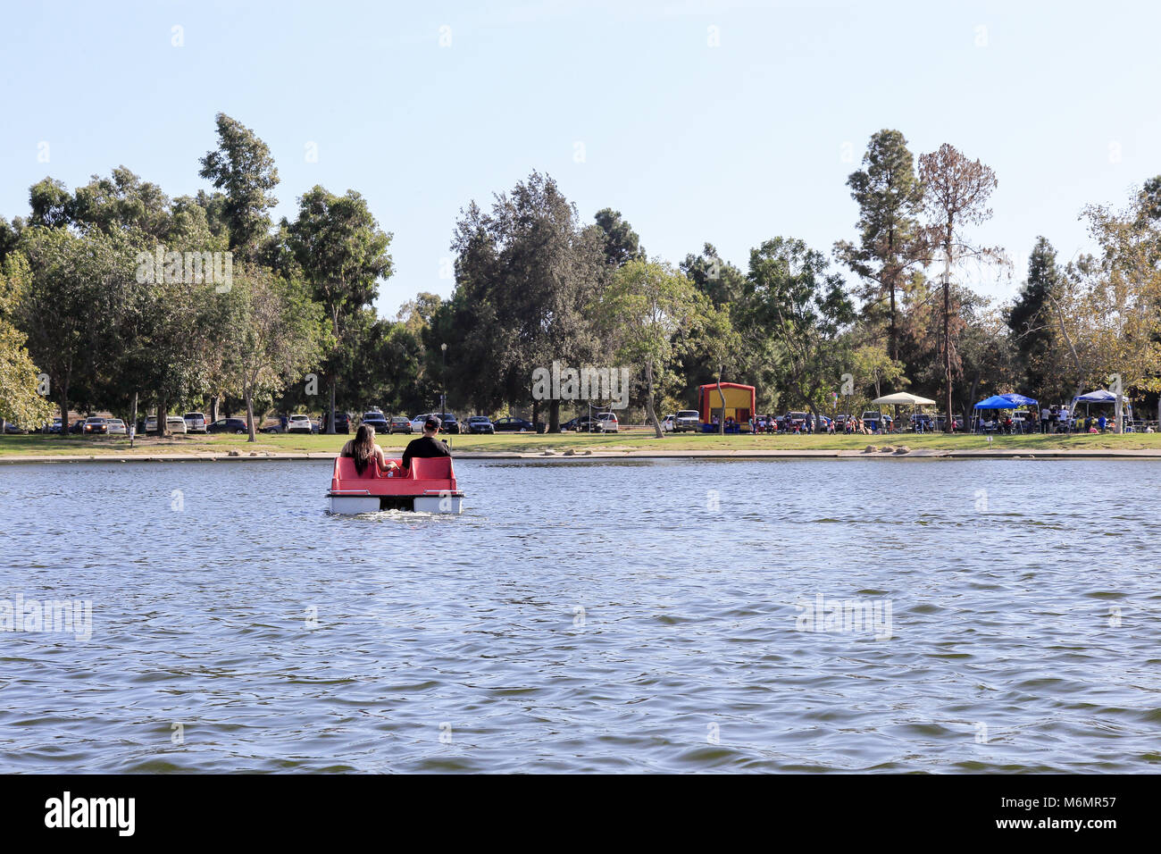 Pedal boating in a lake at El Dorado East Regional Park, Long Beach