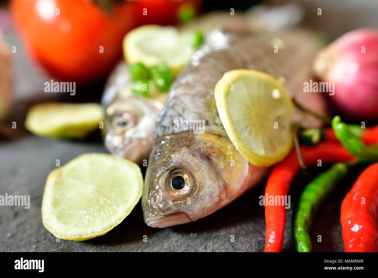 Raw fish on table hi-res stock photography and images - Alamy