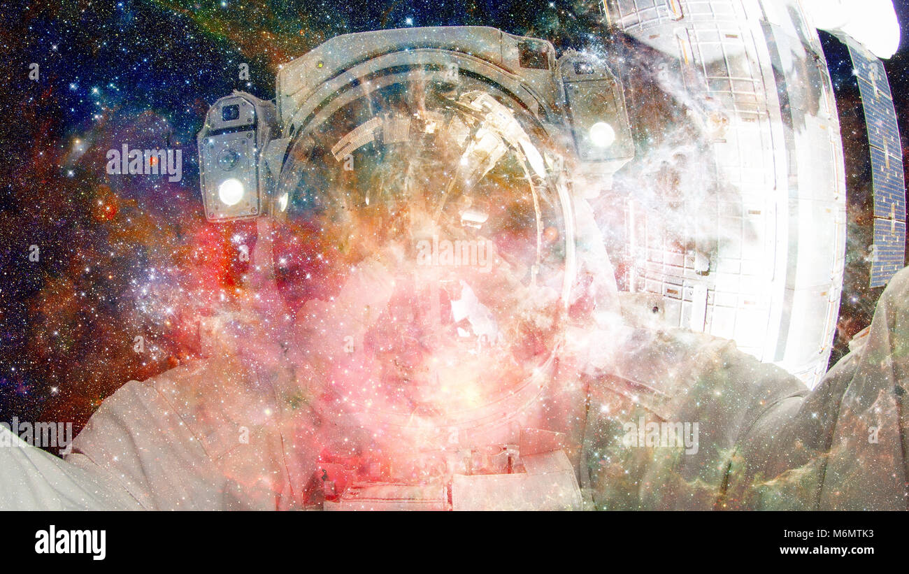 Astronaut in outer space. Science fiction art. Elements of this image ...