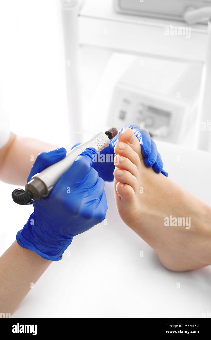 Professional pedicure using dieffenbach scalpel.Patient visiting  podiatrist.Medical pedicure procedure using special instrument with blade  knife holde Stock Photo - Alamy