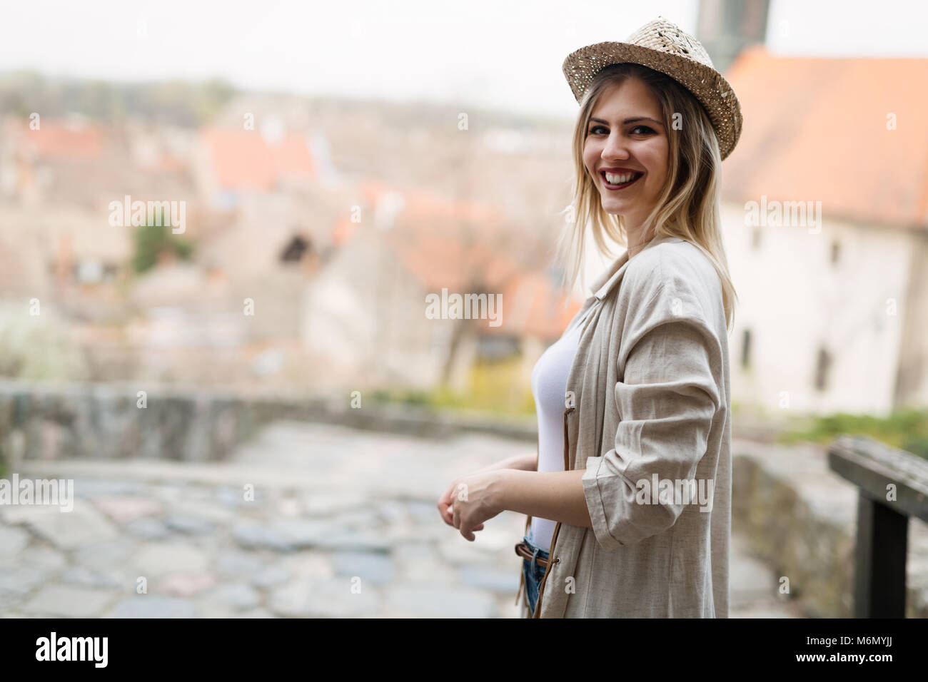 Happy blond female wearing hat outdoor Stock Photo