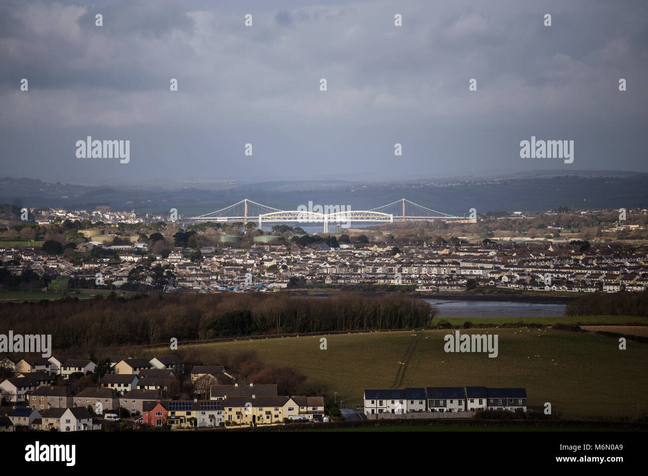 Tamar estuary looking towards Torpoint and The Tamar bridge with the Royal Albert Bridge designed by Isambard Kingdom Brunel Stock Photo