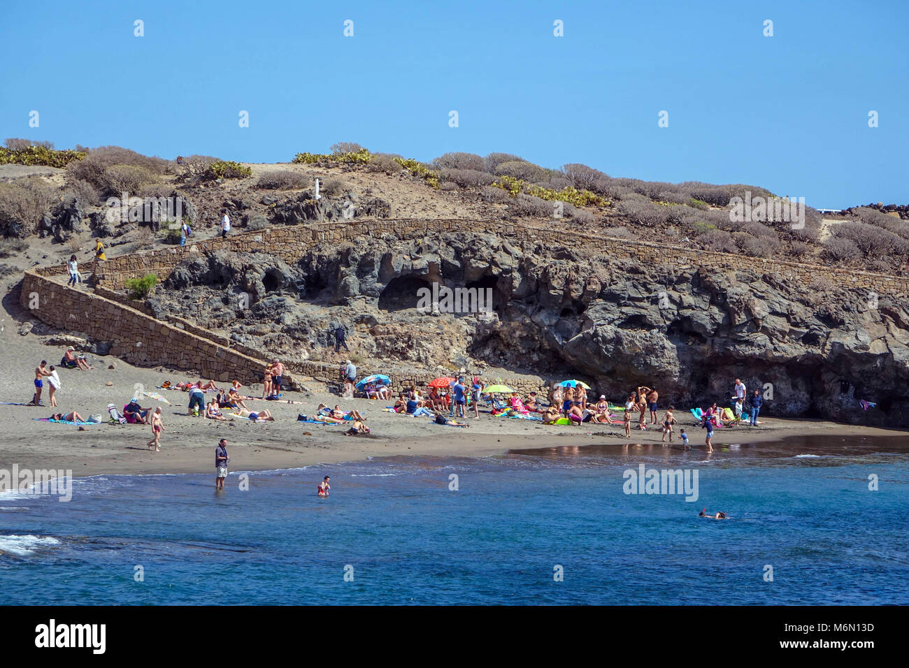 Abades beach, Poris de Abona, Tenerife South with family groups at the weekend Stock Photo