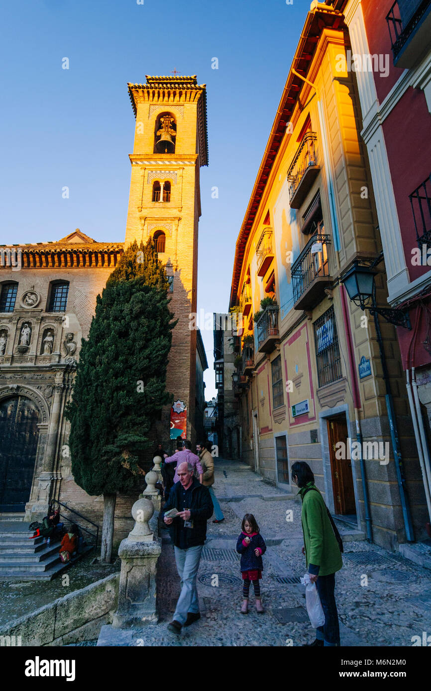 Granada, Andalusia, Spain : Tourist family walks past the Church of Santa Ana in the Unesco listed Albaicin district old town. Stock Photo