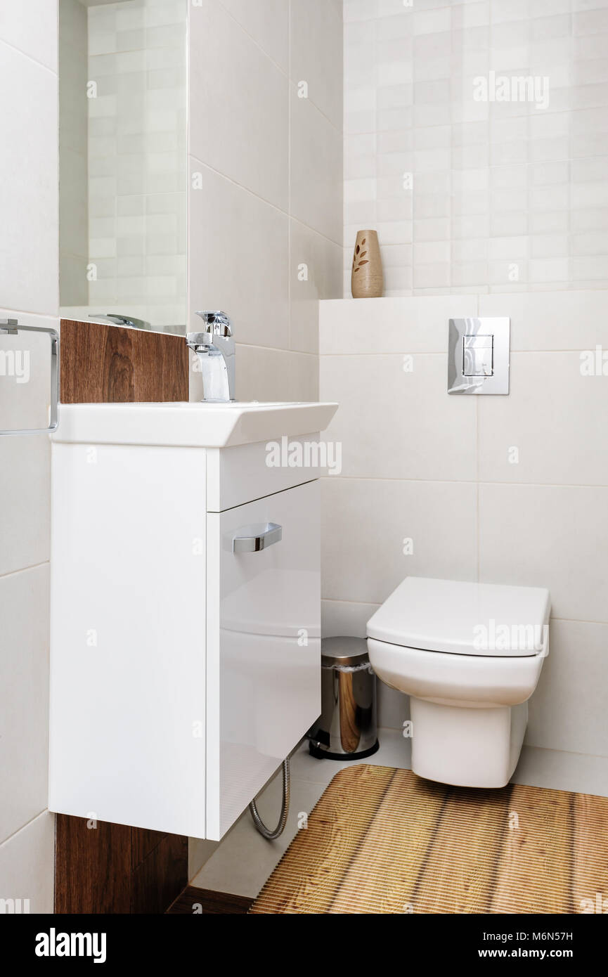 Modern house white and beige bathroom interior Stock Photo - Alamy