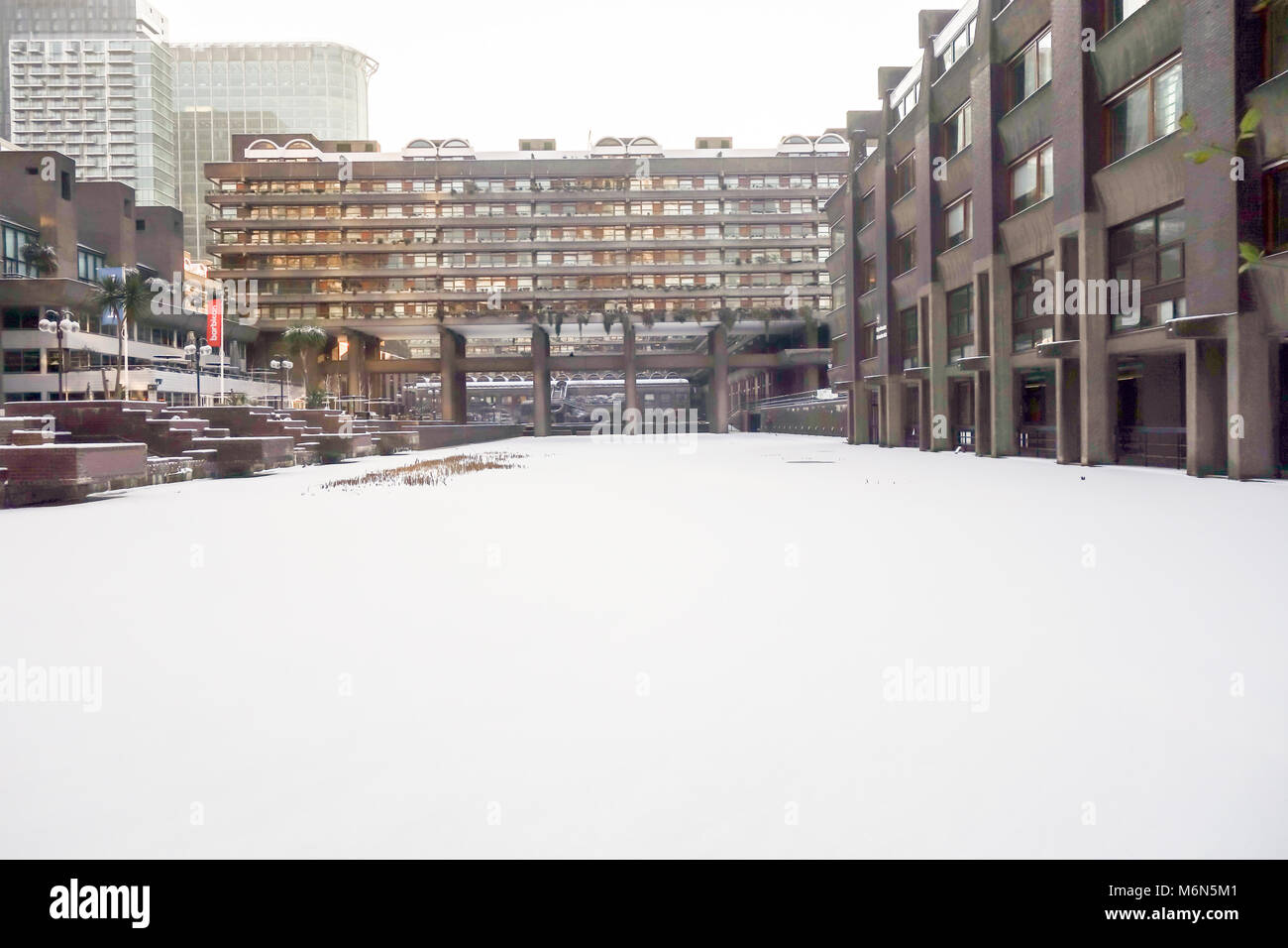 LONDON, UK -28th Feb 2018: Heavy snow falls acrossed the Barbican lake caused by snow storm Emma. Stock Photo