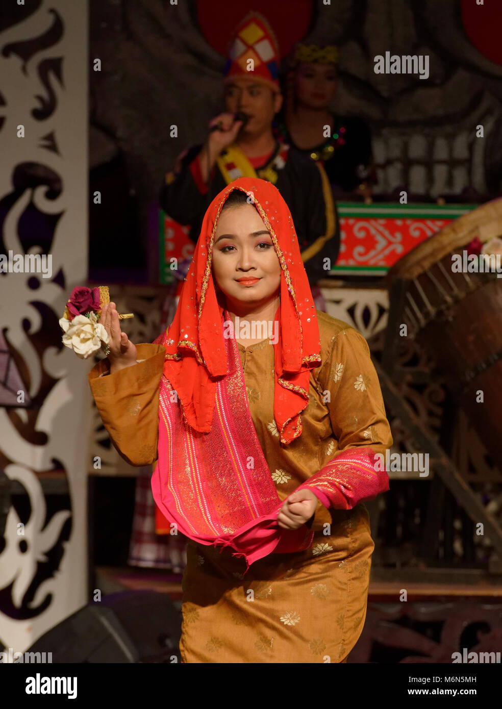 Dancers in traditional native costumes at the Sarawak Cultural Village