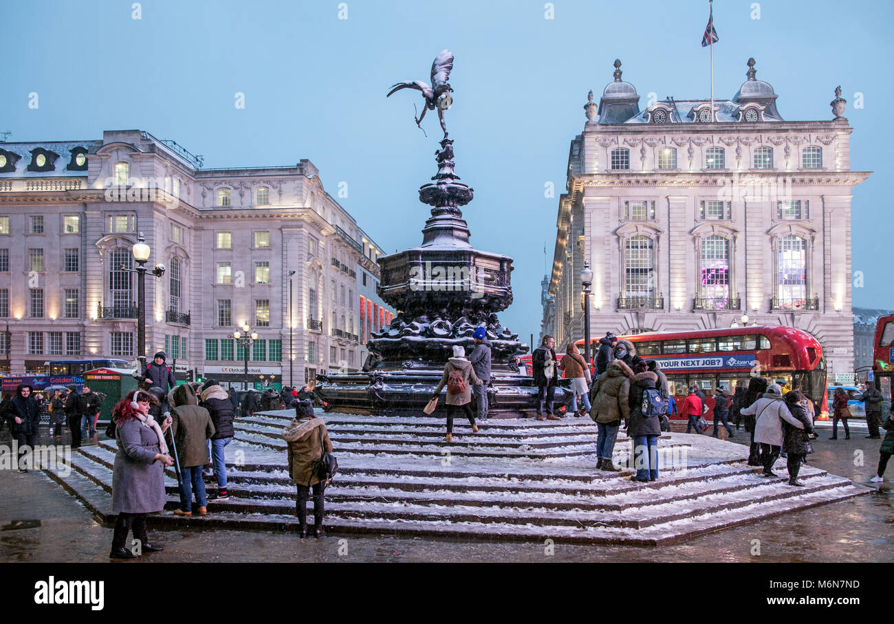 Piccadilly Circus After Snowy Winters Day at Night London UK Stock Photo