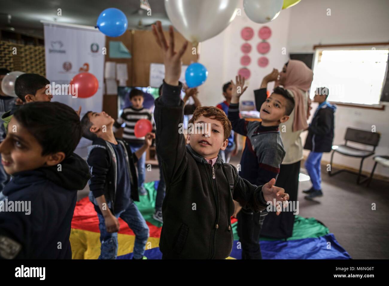 Gaza. 4th Mar, 2018. Palestinian children attend a psychological release session at a family center in Nuseirat refugee camp, central Gaza Strip, on March 4, 2018. The session was held here to help children alleviate the long-term impact of witnessing violence and growing up in a war zone. Credit: Wissam Nassar/Xinhua/Alamy Live News Stock Photo