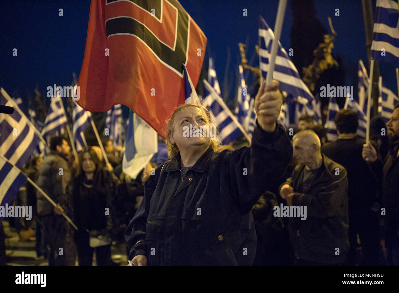 Athens, Greece. 05 March 2018, : Supporters of the Greek far-right party 'Golden Dawn' protest against the Turkish policy with Greek flags and a flag of their party (red-black). Amongst others, they protest against the arrest of two Greek soldiers, who crossed the border to Turkey on 1 March and stated that they got lost. A Turkish court put them into custody on suspicion of attempted military espionage on 2 March. Photo: Socrates Baltagiannis/dpa Credit: dpa picture alliance/Alamy Live News Stock Photo