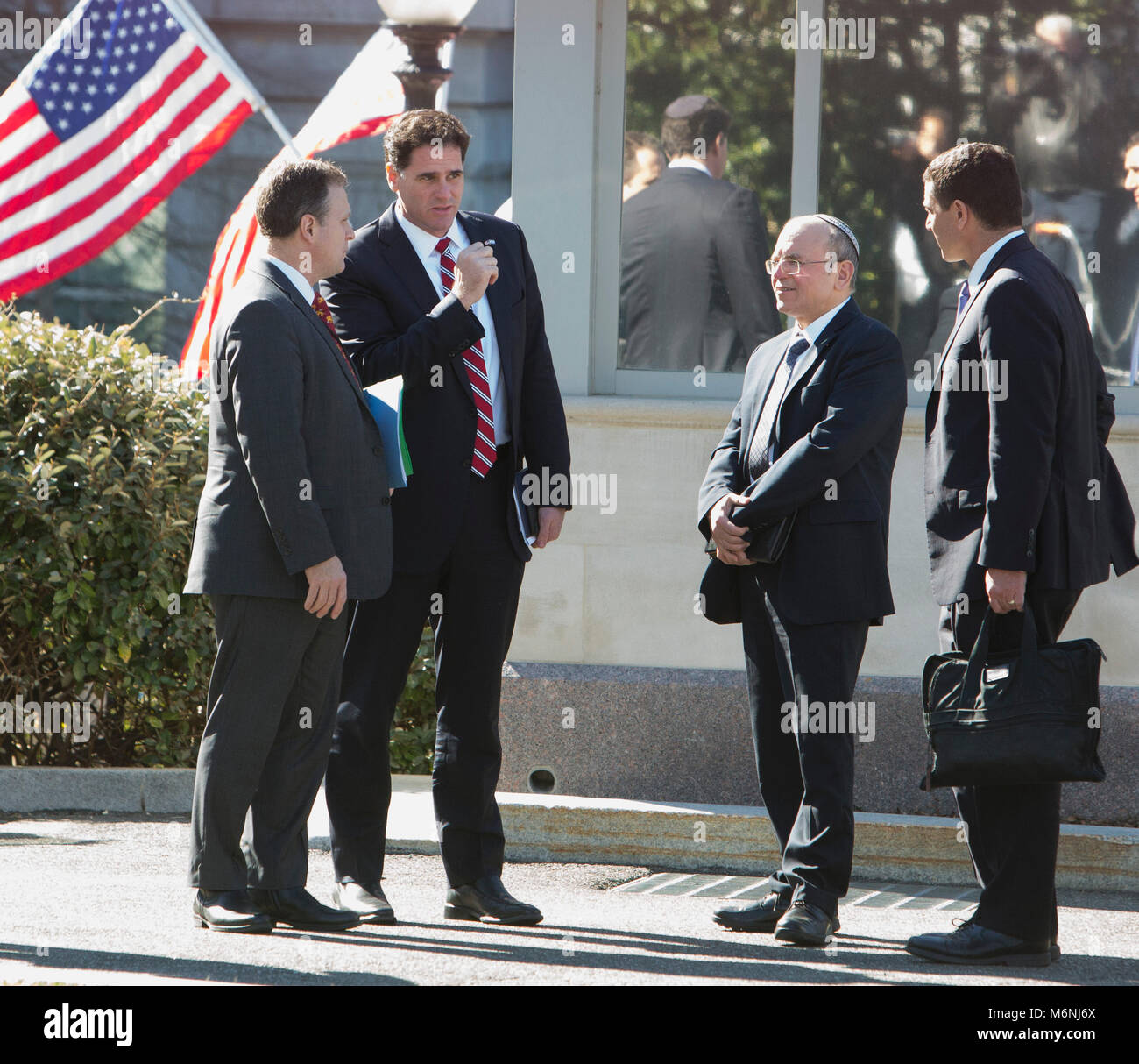 Israel's Ambassador to the United States Ron Dermer(2nd left) chats 