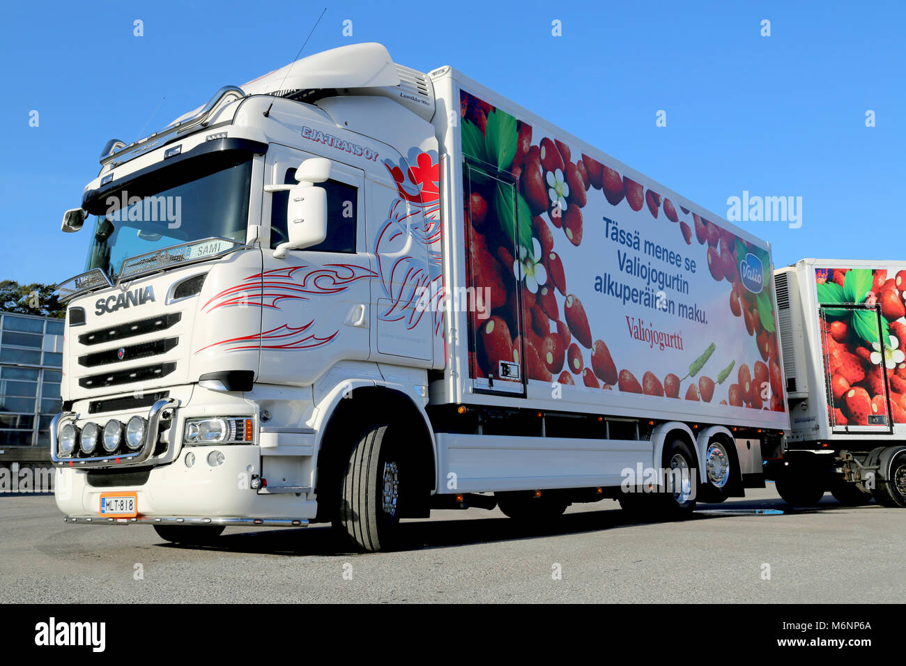 TURKU, FINLAND - MARCH 22, 2014: White Scania V8 truck and full trailer  parked. Scania truck with an Euro 6 engine wins Green Truck award for the  seco Stock Photo - Alamy