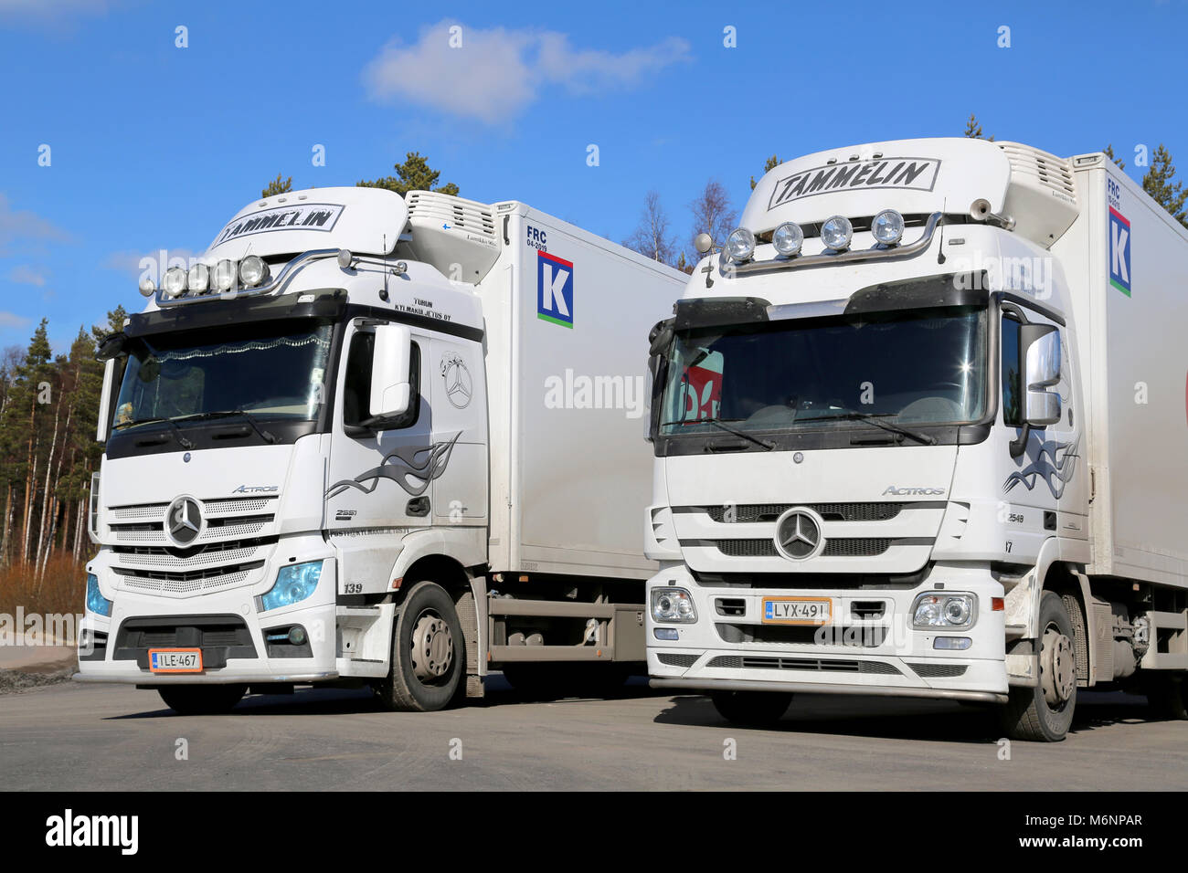 LIETO, FINLAND - MARCH 22, 2014: White Mercedes Benz Actros trucks on a yard. With the TopFit Truck project, Mercedes-Benz is making drivers the focus Stock Photo