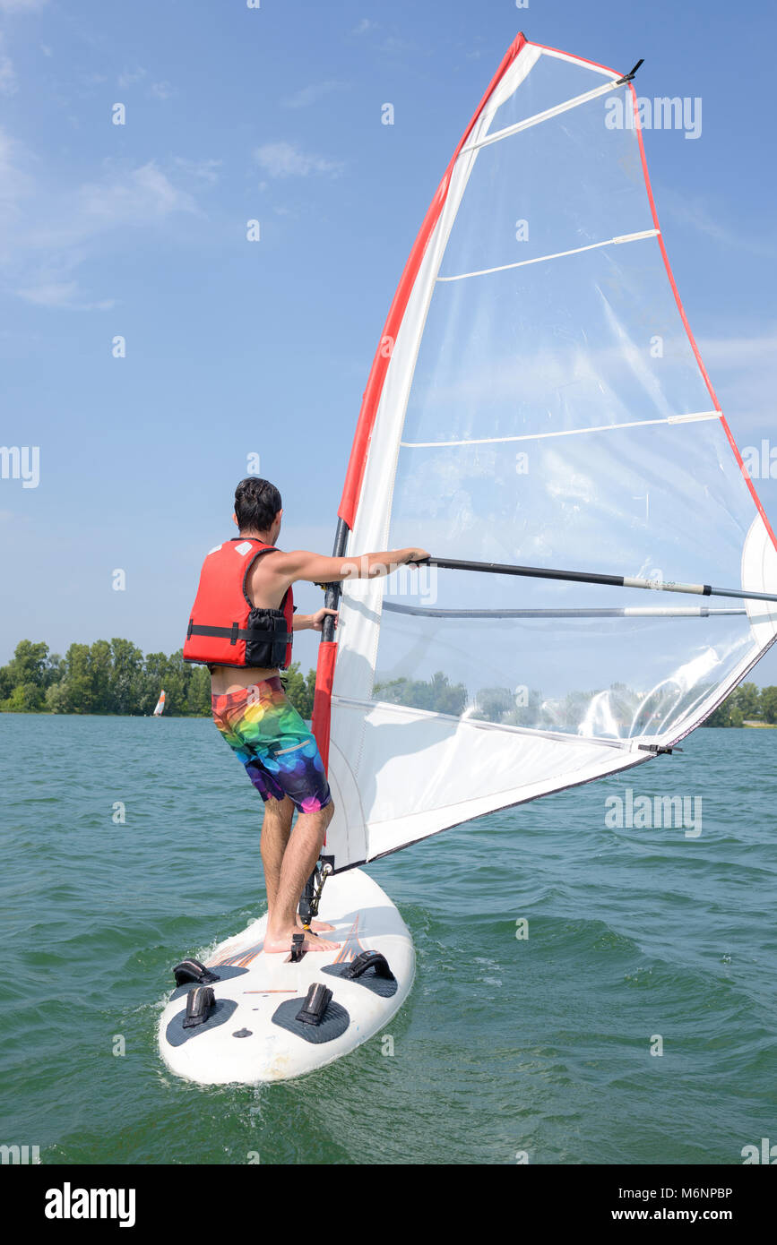 windsurfing on a lake Stock Photo Alamy