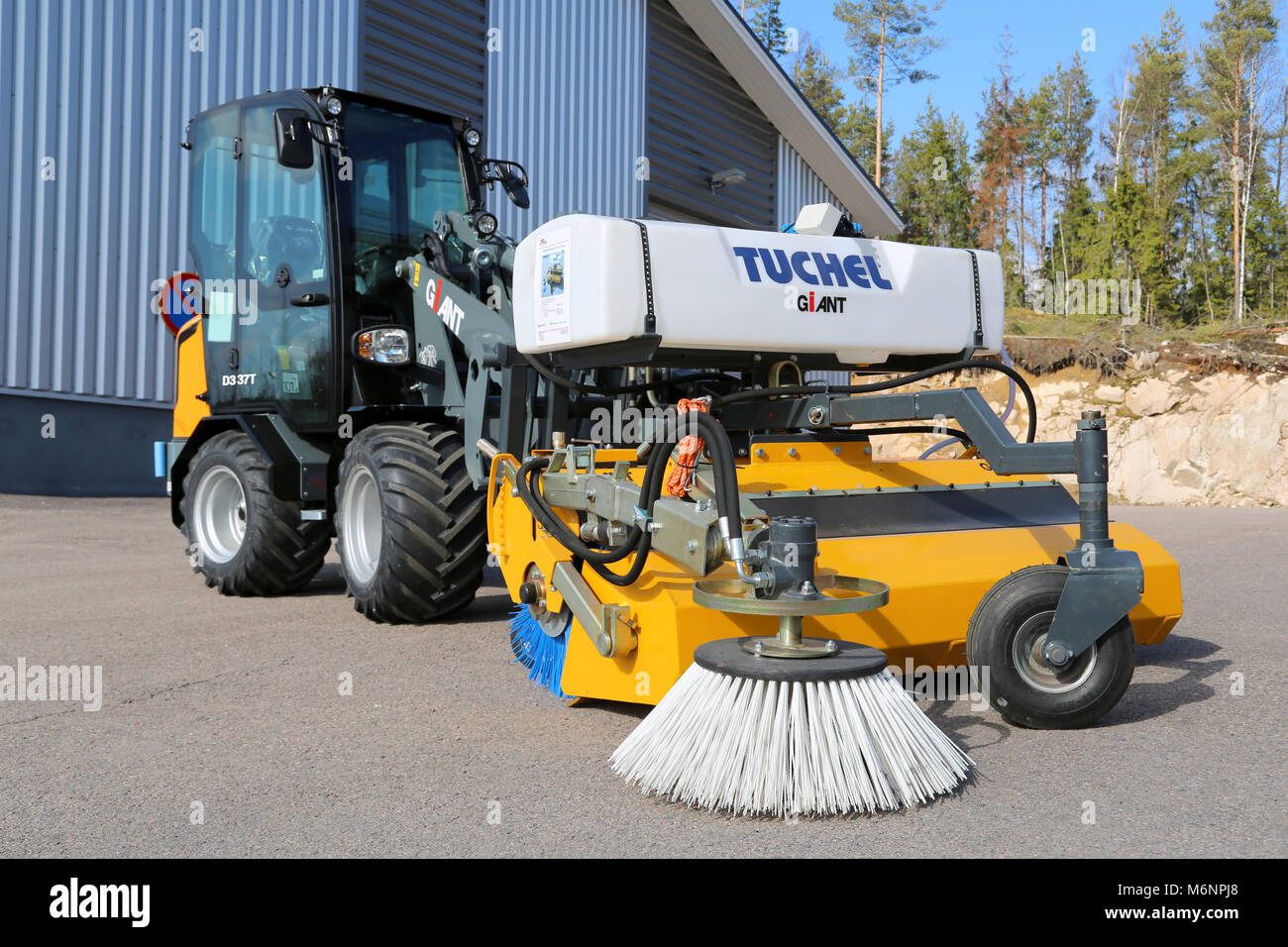 LIETO, FINLAND - MARCH 22, 2014: Giant D337T wheel loader with sweeper displayed at Villilansi heavy equipment marketing event on March 21-22, 2014. Stock Photo