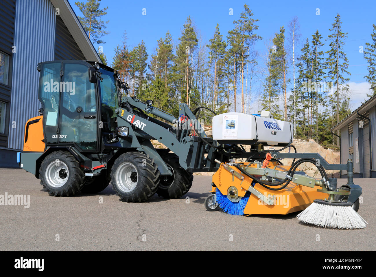LIETO, FINLAND - MARCH 22, 2014: Giant D337T wheel loader with sweeper displayed at Villilansi heavy equipment marketing event on March 21-22, 2014. Stock Photo