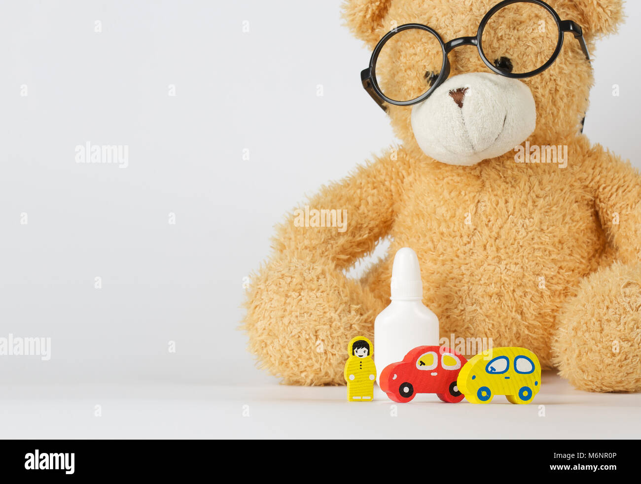 Eyeglasses,mini cars,prescription,wooden made driver on a gray surface Stock Photo Alamy