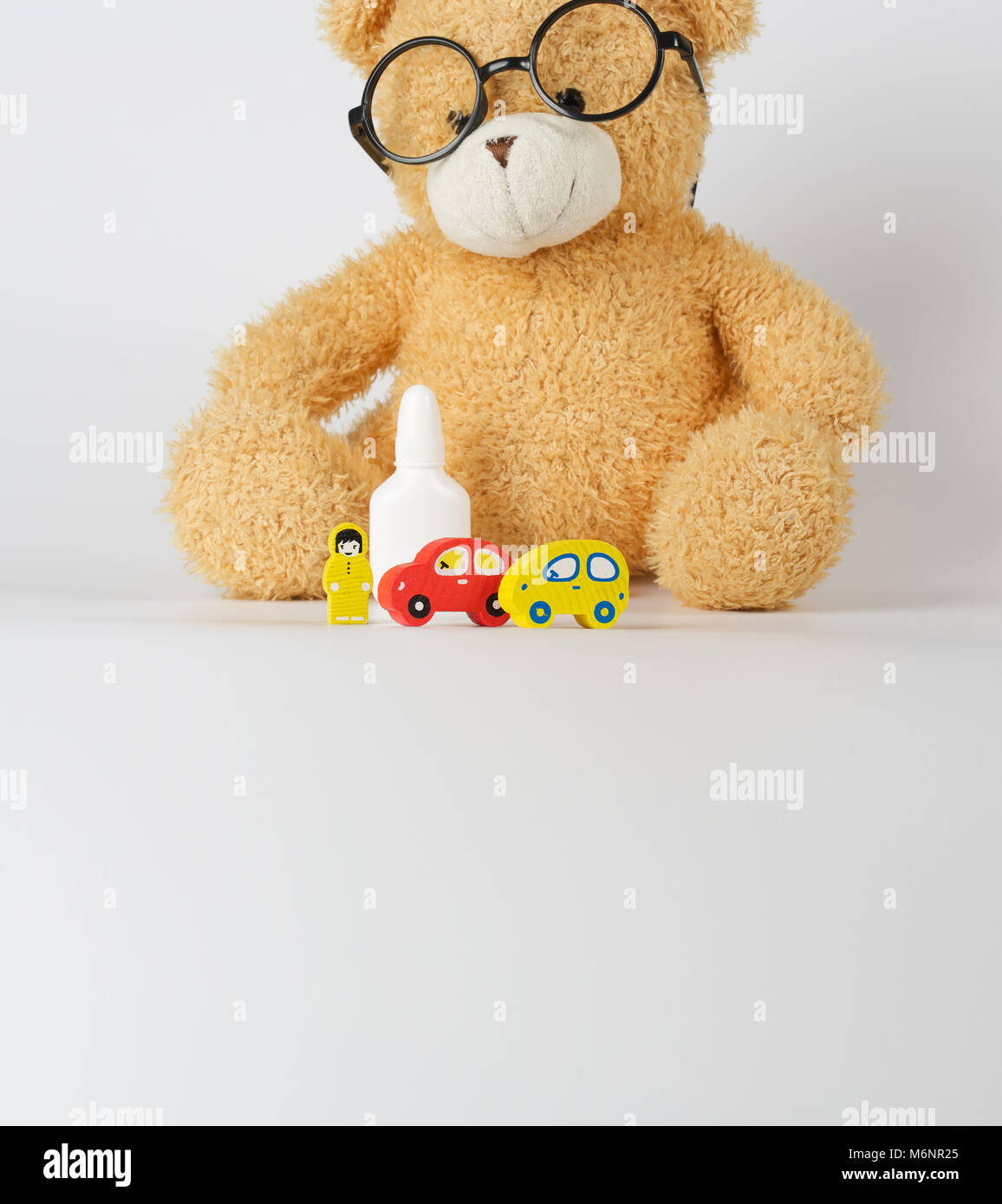 Eyeglasses,mini cars,prescription,wooden made driver on a gray surface Stock Photo Alamy