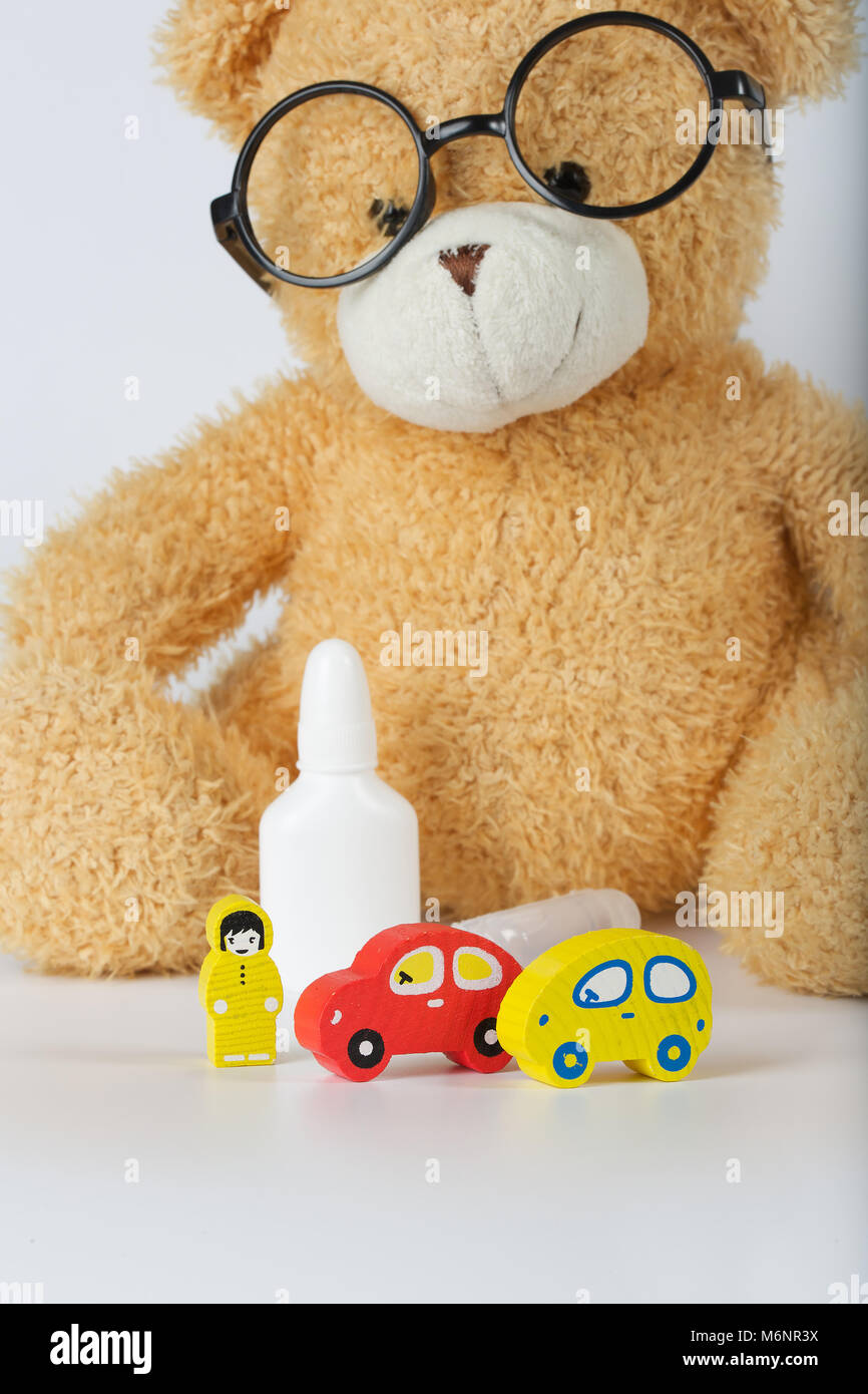 Eyeglasses,mini cars,prescription,wooden made driver on a gray surface Stock Photo Alamy