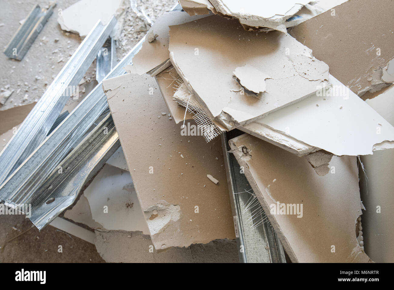 Rubble Railing Heaps of rubble, pices of gypsum plasterboard and mounting rails. Mess ...