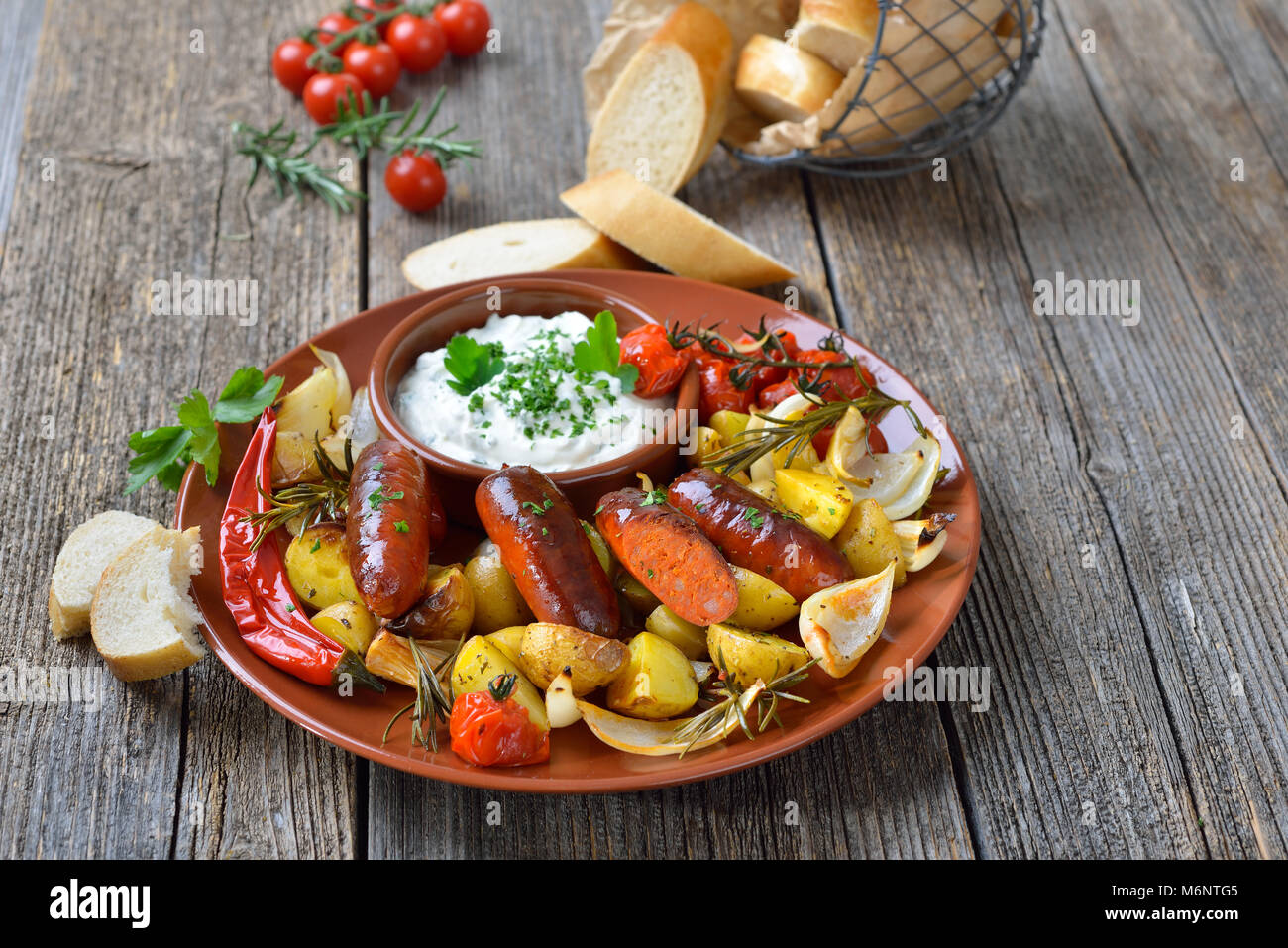 Spanish meal Baked hot chorizo sausages with rosemary vegetables and