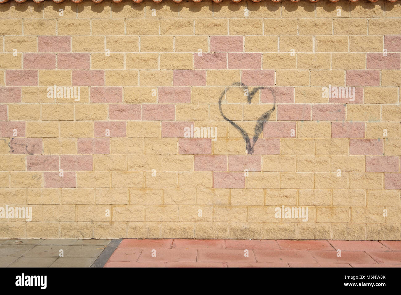 Graffiti heart on a wall. Stock Photo