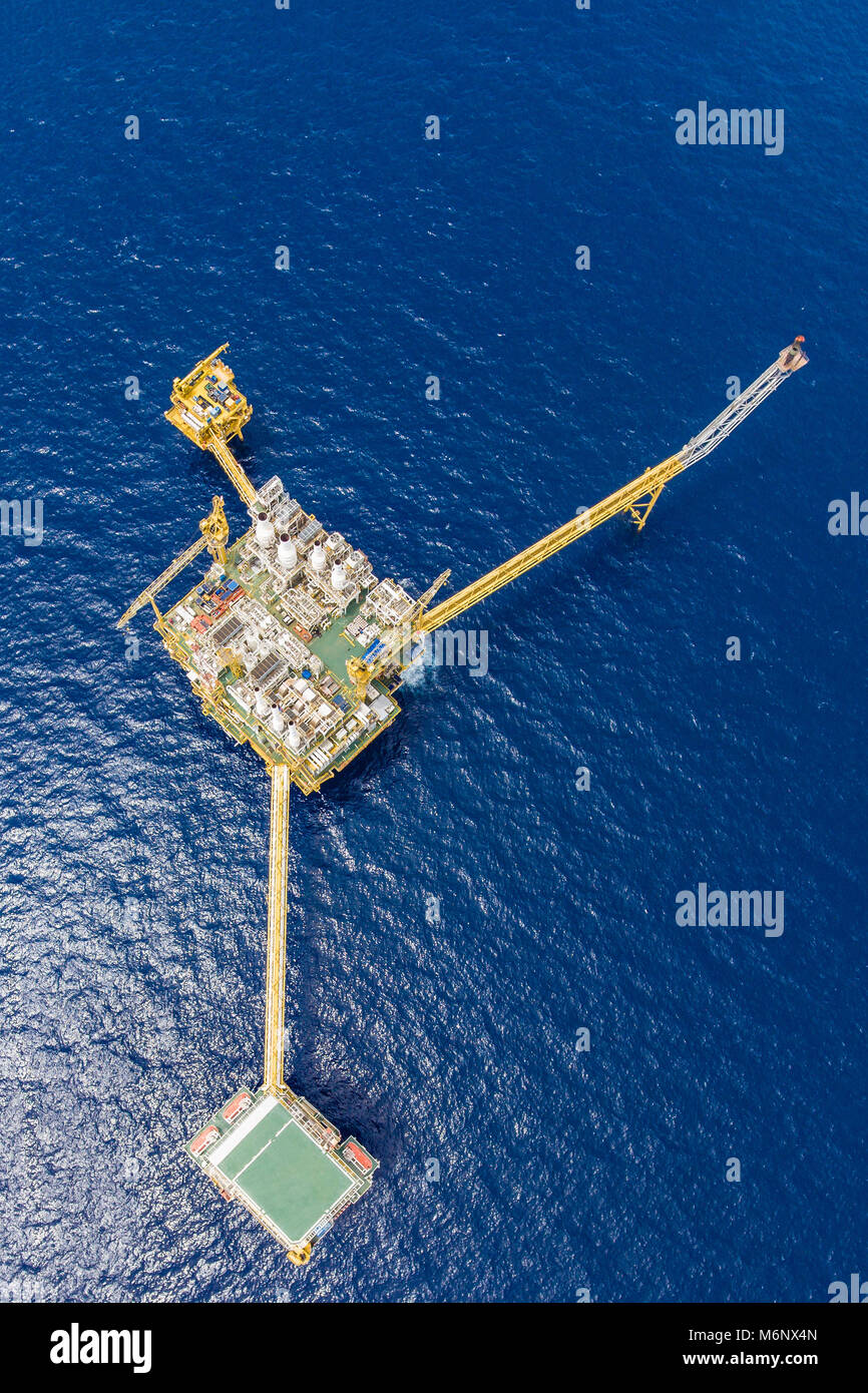 Bird eye view of offshore oil and gas central processing platform which comprised of central facility, accommodation area, flare and remote platform,  Stock Photo