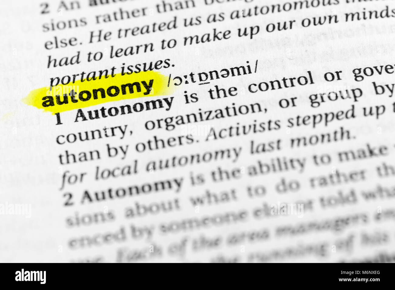 Highlighted English word 'autonomy' and its definition in the dictionary. Stock Photo