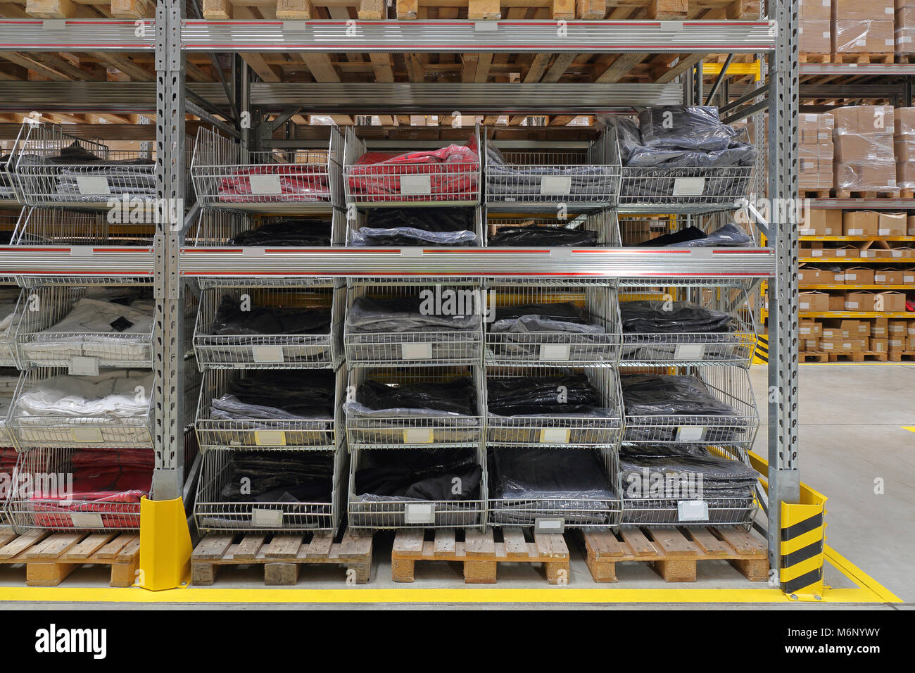 T Shirts in Wire Baskets at Warehouse Shelf Stock Photo - Alamy